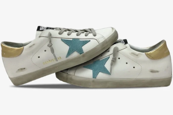 Golden Goose Super-Star white distressed leather sneakers with green star and gold heel, side view. - SKU GWF00101.F000312.10273