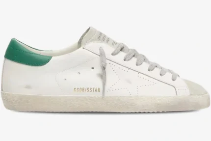 Golden Goose Super-Star white leather sneaker with green heel tab and perforated star, side profile view. - SKU GWF00101.F000312.10273