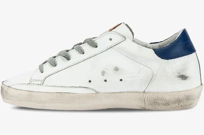 Golden Goose Super-Star sneaker in white and navy, side profile view with distressed finish. - SKU GWF00101.F000321.10271