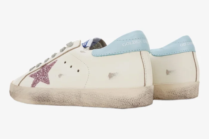 Golden Goose Super-star white low top sneaker with pink glitter star and light blue heel, rear side view. - SKU GWF00101.F000312.10273