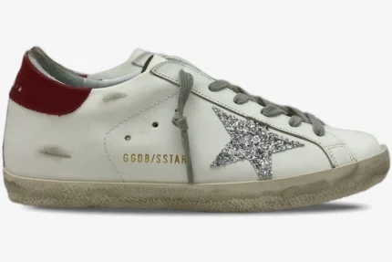 Golden Goose Super-Star white leather sneaker with silver glitter star and red heel tab, side view. - SKU GWF00101.F000312.10272