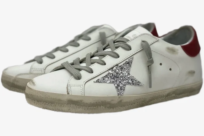 Golden Goose Super-Star white leather sneakers with silver glitter star and red heel tab, side view. - SKU GWF00101.F000312.10272