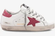 Golden Goose Super-Star white leather sneaker with rose glitter star and heel tab, side profile view. - SKU GWF00101.F000321.10273