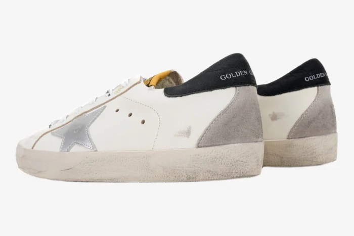 Golden Goose Super-Star white sneakers with silver star and black heel tab, side and rear view. - SKU GMF00101.F000312.10273