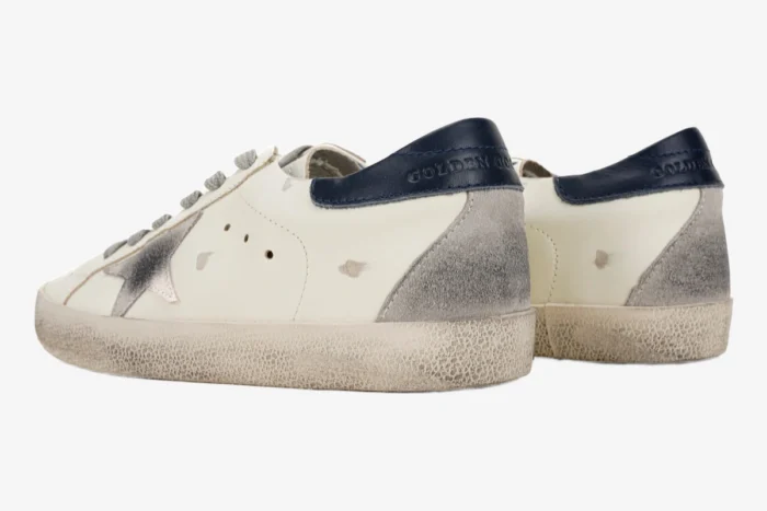 Golden Goose Super-Star white leather sneakers with blue heel tab and suede star, rear side view. - SKU GMF00101.F000312.10273