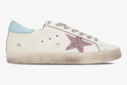 Side view of a Golden Goose Super-star white leather sneaker with a pink glitter star and blue heel tab. - SKU GWF00101.F000312.10273