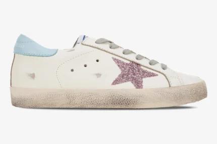 Side view of a Golden Goose Super-star white leather sneaker with a pink glitter star and blue heel tab. - SKU GWF00101.F000312.10273