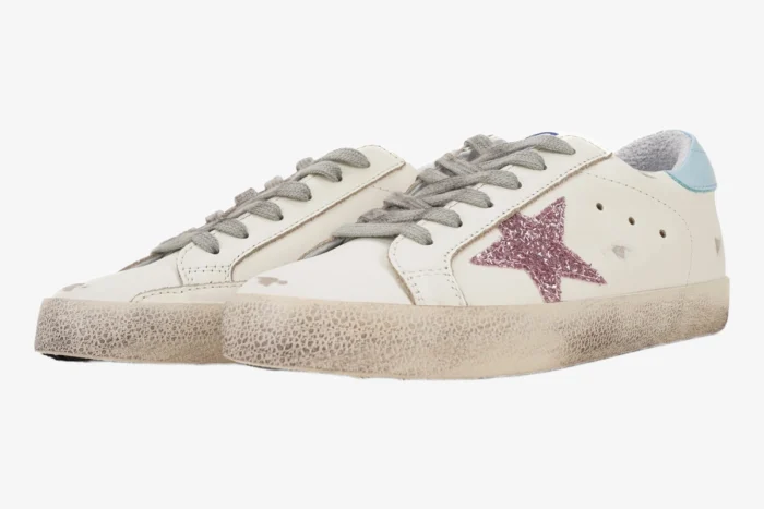 Golden Goose Super-star white low top sneakers with pink glitter star and blue heel tab, side view. - SKU GWF00101.F000312.10273