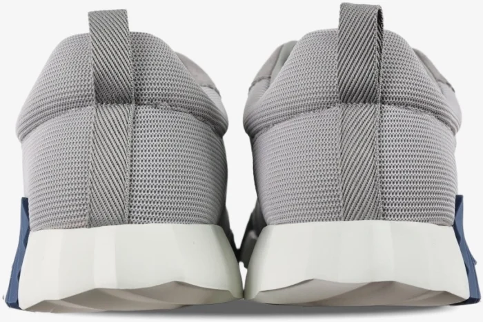 Back view of grey Hermès Bouncing Sneakers with white chunky soles and blue accents. - SKU H202934ZH