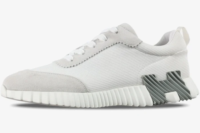 Hermes Bouncing Sneakers in white and grey mesh, side profile view showing the textured sole and H logo detail. - SKU H202934ZH02