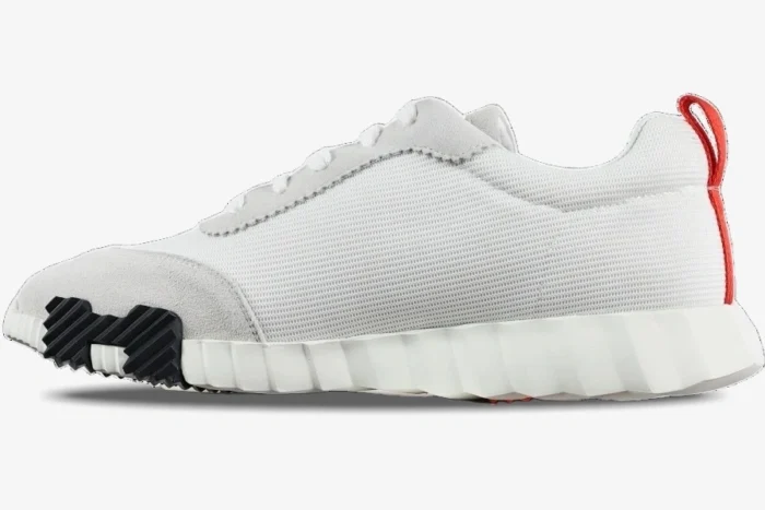 Hermes Bouncing Sneakers in white mesh and grey suede, side profile view with orange heel tab. - SKU H202934ZH