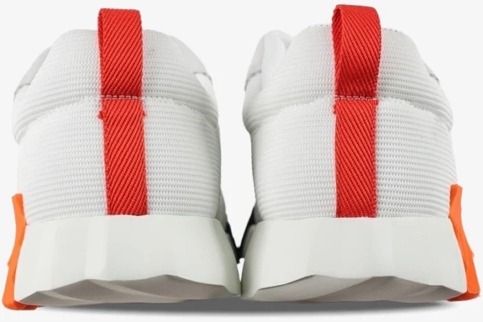 Rear view of Hermes Bouncing sneakers in white mesh with red pull tabs and orange sole accents. - SKU H202934ZH