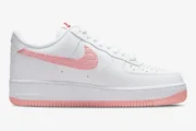 Nike Air Force 1 '07 Valentine's Day in white and pink, side profile view showing the embossed Swoosh. - SKU DQ9320-100