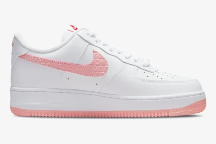 Nike Air Force 1 '07 Valentine's Day in white and pink, side profile view showing the embossed Swoosh. - SKU DQ9320-100