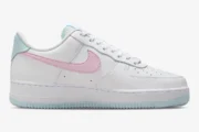 Side view of Nike Air Force 1 '07 Cotton Candy sneakers in white with pink swoosh and light blue accents. - SKU DD8959-100