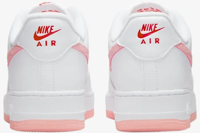 Rear view of white Nike Air Force 1 '07 Valentine's Day sneakers with red logos and pink accents. - SKU DQ9320-100