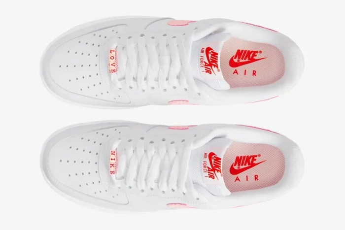 Top-down view of white Nike Air Force 1 '07 Valentine's Day sneakers with pink accents and bead lace charms. - SKU DQ9320-100