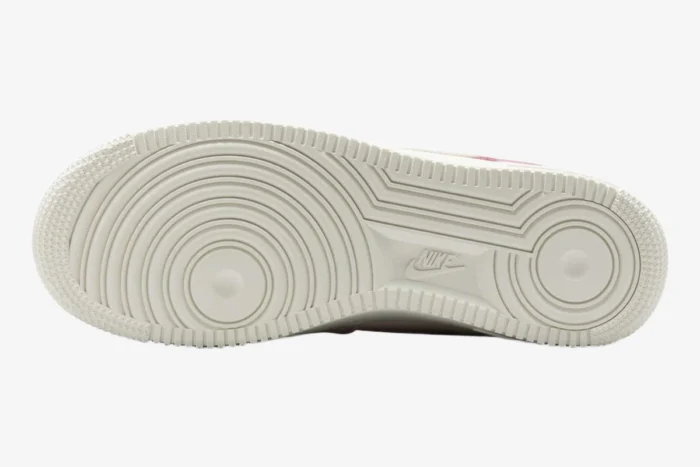 Bottom view of the Nike Air Force 1 Low '07 LX Sail Pearl Pink outsole showing the classic pivot point tread pattern.