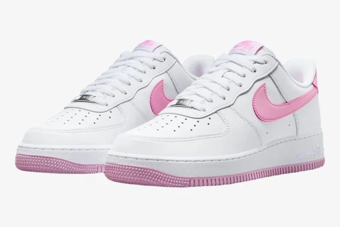 Nike Air Force 1 Low Bubblegum sneakers in white and pink, three-quarter front view. - SKU FJ4146-101