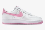 Side profile of Nike Air Force 1 Low Bubblegum sneakers in white with pink accents. - SKU FJ4146-101