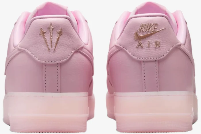 Rear view of Nike Air Force 1 x NOCTA Pink Foam sneakers showing embroidered heel logos. - SKU CZ8065-600