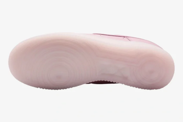 Bottom view of the Nike Air Force 1 x NOCTA Pink Foam sneaker showing its translucent pink outsole. - SKU CZ8065-600
