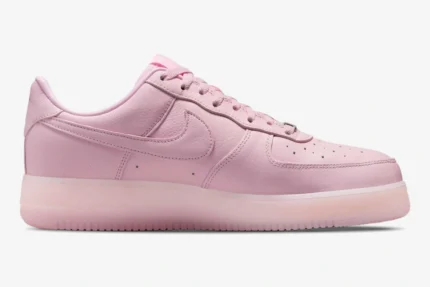 Side profile of a Nike Air Force 1 x NOCTA sneaker in Pink Foam with a translucent sole. - SKU CZ8065-600