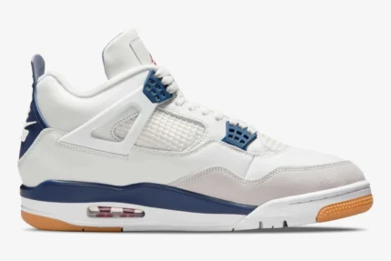 Nike SB Air Jordan 4 Navy sneakers in a side profile view featuring white leather and a gum outsole. - SKU DR5415-100